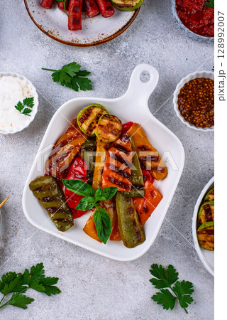 Assortment of grilled bbq meat and vegetables Assortment of grilled bbq meat and vegetables 128992007