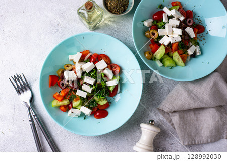Greek salad with vegetables, olives and feta cheese Greek salad with vegetables, olives and feta cheese 128992030