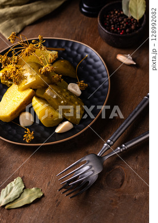 Bowl of pickled marinated cucumbers 128992082