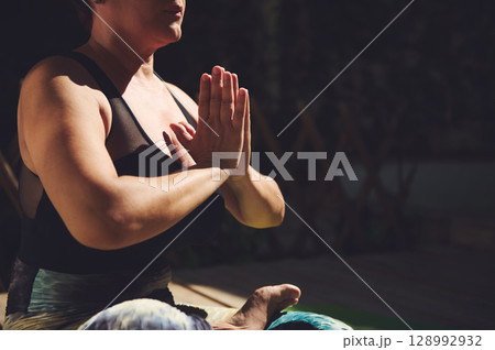 Serene Yoga Pose Practiced Outdoors Focusing on Mind-Body Harmony Serene Yoga Pose Practiced Outdoors Focusing on Mind-Body Harmony 128992932