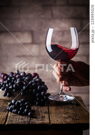 Red wine and ripe grapes Red wine and ripe grapes 128995026