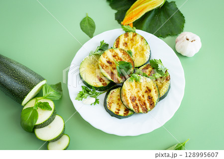 Fried zucchini slices in a healthy food style 128995607
