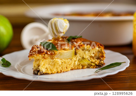 Classic apple pie in a ceramic mold the taste of childhood at home 128995626