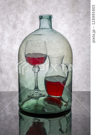 Still life "Internal contents" with glass objects and wine Still life "Internal contents" with glass objects and wine 128995805