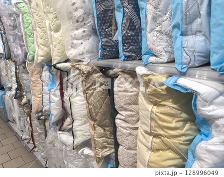 Cozy bedding collection lined up for a delightful shopping experience 128996049