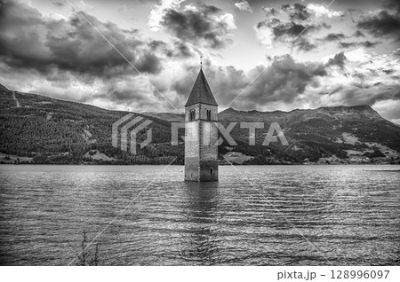 The iconic submerged Church Tower of Graun, Lake Reschensee, Italy 128996097
