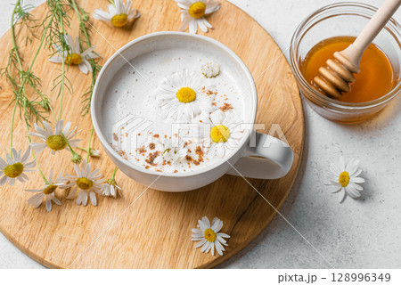 Chamomile tea latte with honey, raf coffee cup. Moon milk. 128996349