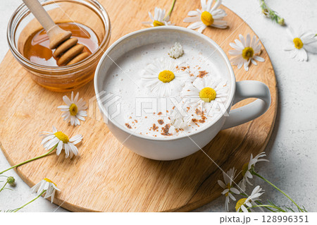 Chamomile tea latte with honey, raf coffee cup 128996351