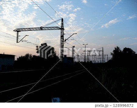 sunset over traction railroad tracks 128996872