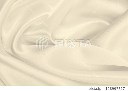 Smooth elegant golden silk or satin luxury cloth texture as wedding background. Luxurious background design. In Sepia toned. Retro style 128997727