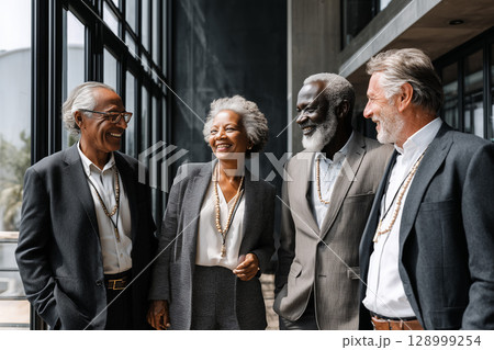 Diverse Group of Professionals Engaging in Discussion in Modern Office Setting 128999254