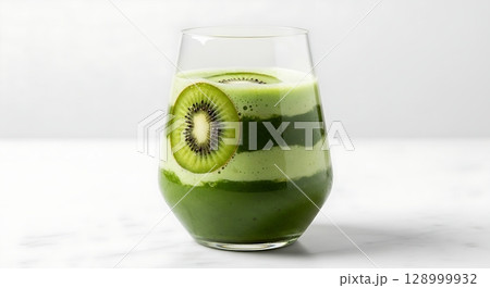 Artfully Layered Green Smoothie with a Vibrant Kiwi Slice Garnish in a Stemless Glass. Artfully Layered Green Smoothie with a Vibrant Kiwi Slice Garnish in a Stemless Glass. 128999932