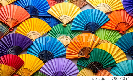 Traditional Japanese folding paper fan on a red background 129004854