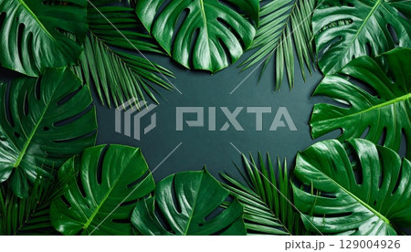 Vibrant green leaves form a natural frame, perfect for a summer or spring background 129004926