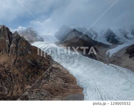 Aerial view of beautiful hanging glacier in high altitude mountains landscape 129005032