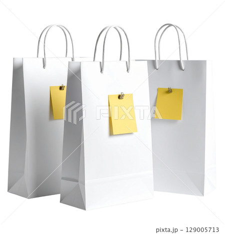 Isolated blank brown paper shopping bag with handles 129005713