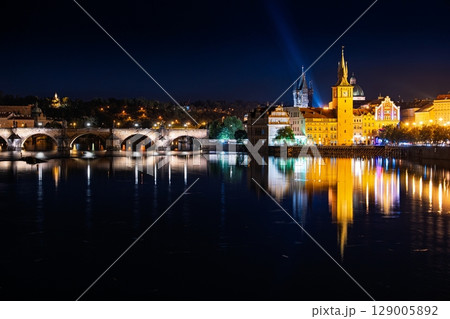 Nighttime Splendor Prague s Charles Bridge and Illuminated Architecture Reflecting in Vltava River Nighttime Splendor Prague s Charles Bridge and Illuminated Architecture Reflecting in Vltava River 129005892