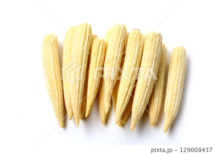 Fresh baby corn on white background. Fresh baby corn on white background. 129008437