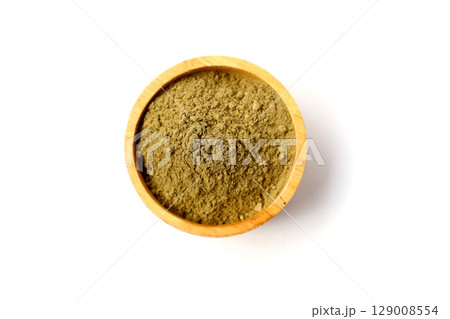 Gotu kola powder (Centella asiatica) in a wooden spoon on white background. 129008554