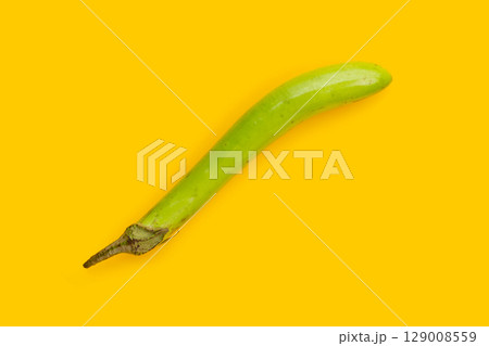 Fresh green eggplant on yellow background. 129008559
