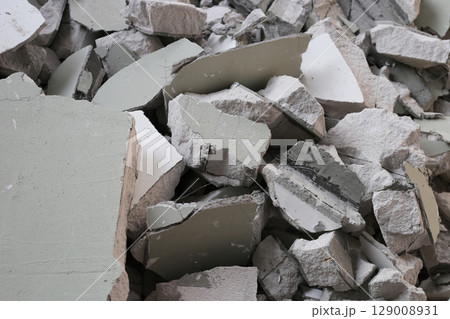 Broken concrete, Piles of lightweight construction bricks after house demolition Broken concrete, Piles of lightweight construction bricks after house demolition 129008931
