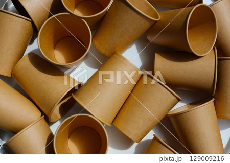 Brown paper cups on white background. Brown paper cups on white background. 129009216