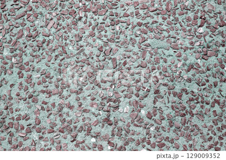 Outdoor rocks with cement walkway surface 129009352