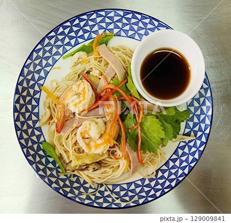 Stir-fried Noodles with Shrimp, Pork, and Vegetables on Decorative Plate Stir-fried Noodles with Shrimp, Pork, and Vegetables on Decorative Plate 129009841
