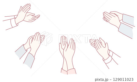 A diverse group of hands clapping energetically in applause for a great performance 129011023