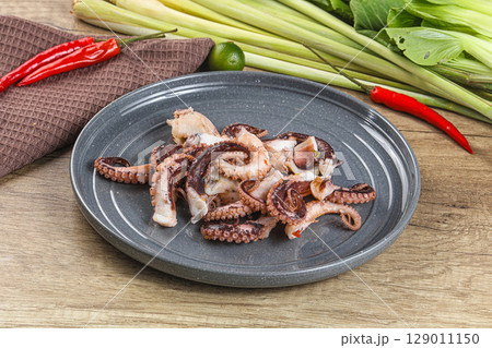 Grilled octopus tentacle sliced appetizer 129011150