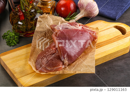 Raw uncooked turkey thigh fillet 129011163