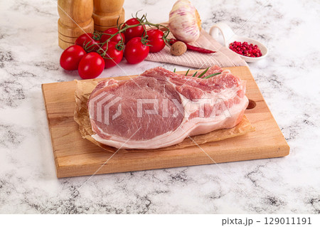 Raw potk loin steak with bone 129011191