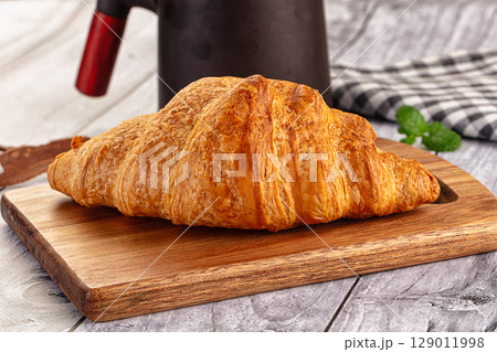 Fresh hot homemade croissant for breakfast Fresh hot homemade croissant for breakfast 129011998