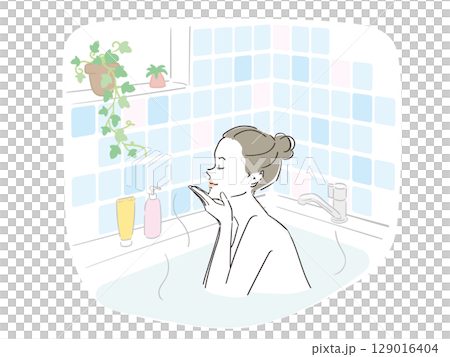 A beautiful woman taking a comfortable bath 129016404