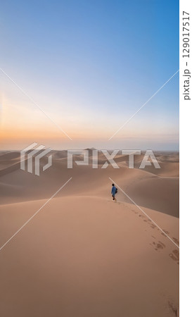 Vast Desert Landscape, Arid Beauty, Solitude, Self-Discovery. Ideal for adventurous travel, artistic expression, introspective journeys Vast Desert Landscape, Arid Beauty, Solitude, Self-Discovery. Ideal for adventurous travel, artistic expression, introspective journeys 129017517