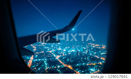Night Flight over City, Tranquil Journey, Urban Glow, Serene View. Ideal for night travel, reflective moments, city lights Night Flight over City, Tranquil Journey, Urban Glow, Serene View. Ideal for night travel, reflective moments, city lights 129017681