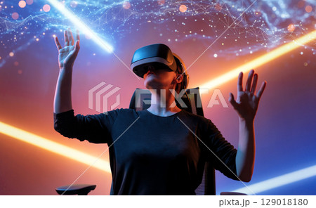 Woman with VR virtual reality goggles 129018180