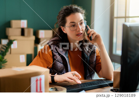 Woman working in a warehouse Woman working in a warehouse 129018189