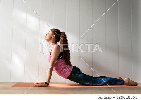 woman is doing yoga woman is doing yoga 129018565
