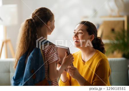 Happy family preparing for school 129018581