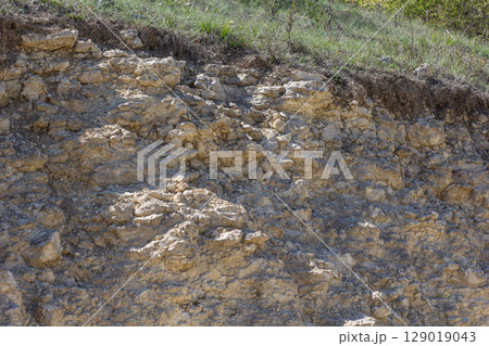Eroded Limestone Cliff with Grass Top Eroded Limestone Cliff with Grass Top 129019043