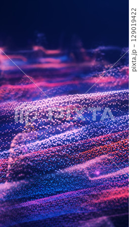 A sea of sparkling particles in purple and pink flows like waves, forming an abstract digital landscape 129019422