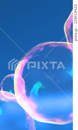 Close-up of colorful iridescent soap bubbles gently floating against a bright blue sky background Close-up of colorful iridescent soap bubbles gently floating against a bright blue sky background 129019428