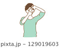 手から覗くポーズの女性 129019603