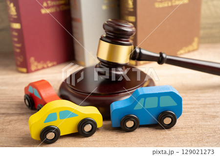 Car accident lawsuit and insurance, Judge hammer with car model. 129021273