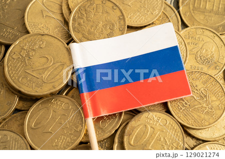 Russia flag on coin and banknote money, finance trading investment business currency. 129021274
