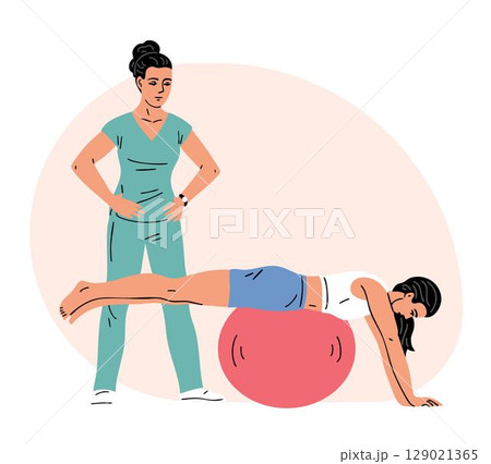 A young woman exercises with a gym ball under the supervision of a physiotherapist 129021365