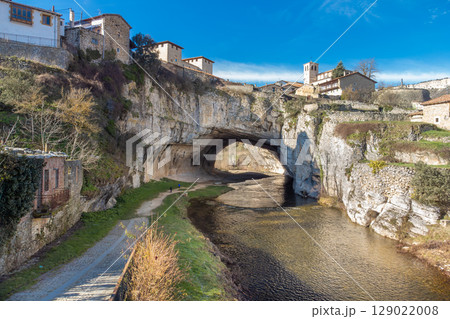 Aerial view of Puentedey, a picturesque village with a natural bridge over the river. Burgos, Spain. Aerial view of Puentedey, a picturesque village with a natural bridge over the river. Burgos, Spain. 129022008