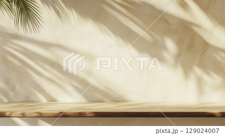 light beige wall with wooden shelf and palm leaf shadows light beige wall with wooden shelf and palm leaf shadows 129024007