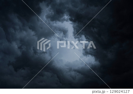 Dark blue storm clouds before rain. Bad weather, darkness, death. 129024127